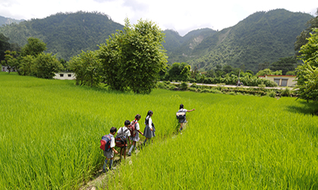 Children in India walking home from school. Photo by HPP India. 